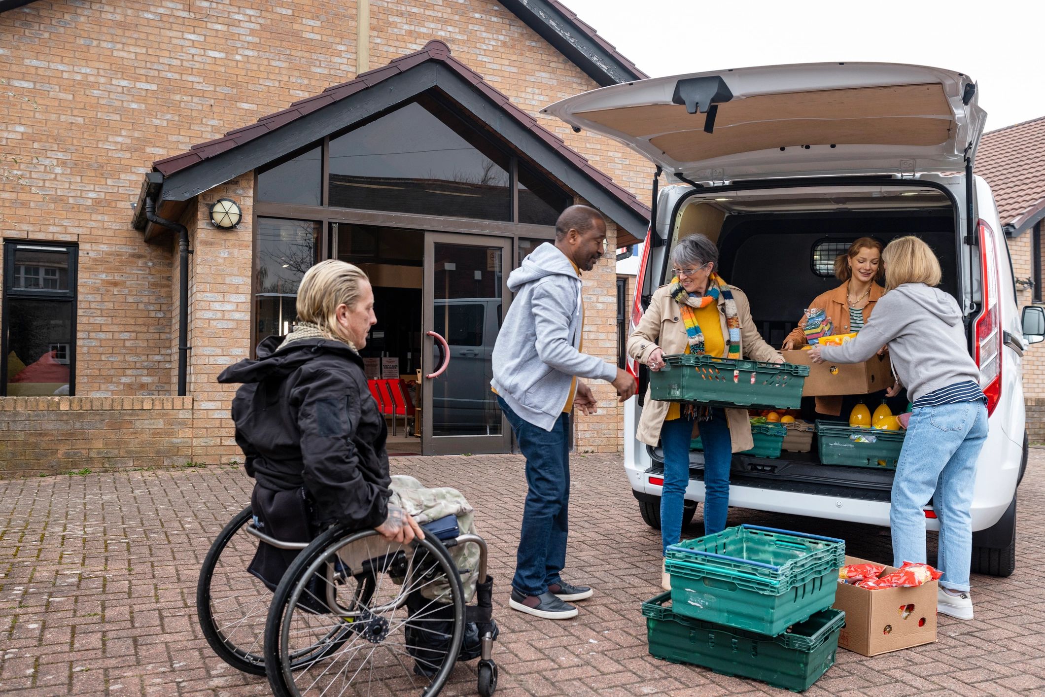 Volunteers preparing food donations together